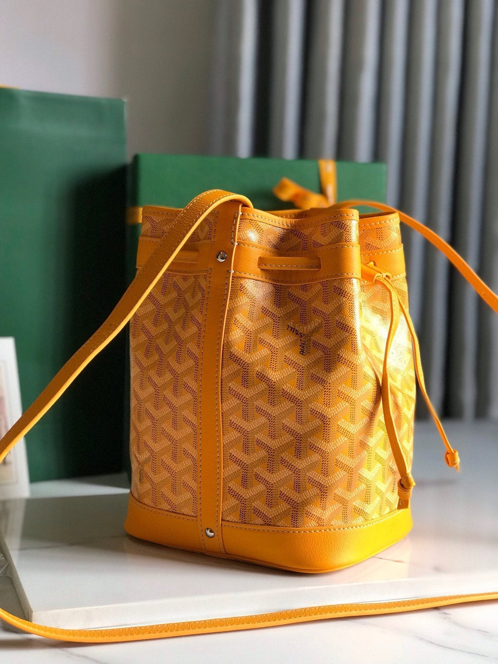 PETIT FLOT BUCKET BAG 22 IN YELLOW GOYARDINE CANVAS AND LAMBSKIN TRIM